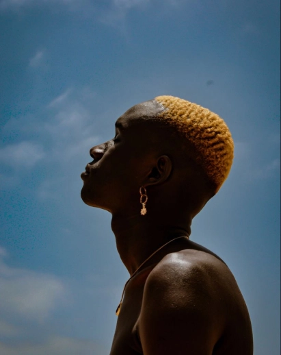 Portrait of a black man with the sky in the background